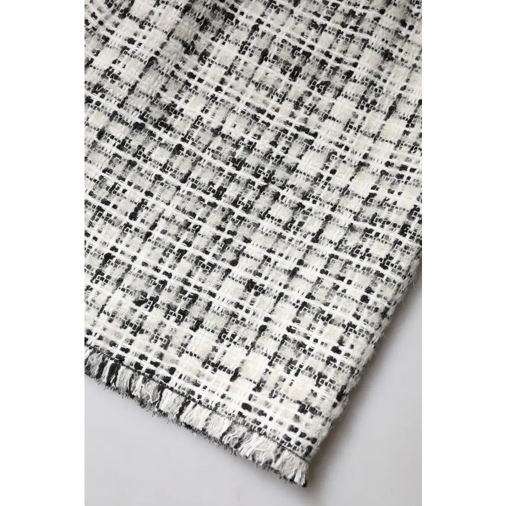 Dolce & Gabbana white black high waist tartan tweed mini skirt in black and white fabric with textured woven pattern and frayed edges