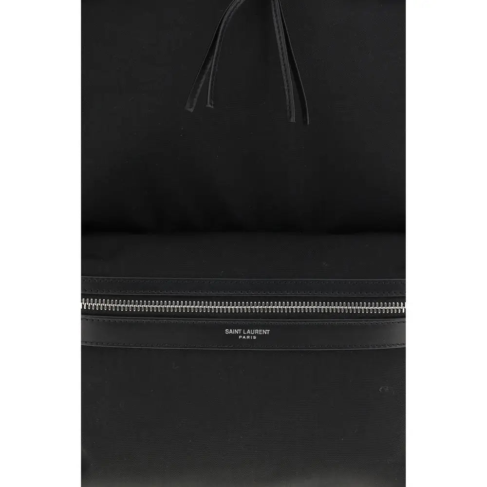 Saint Laurent black fabric backpack med minimalist design og sølv lynlås