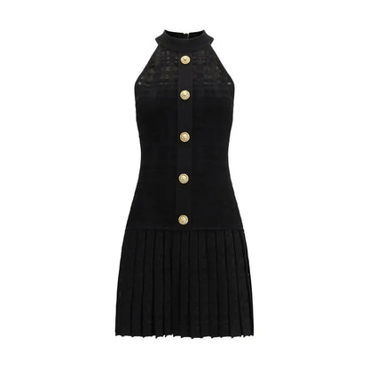 Balmain sort halter-hals kjole i sort viscose med guldknapper og plisséreret nederdel