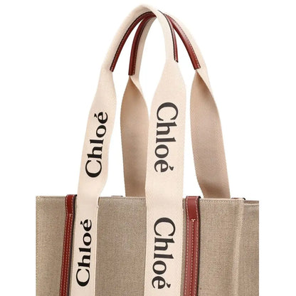 Chloé beige linen tote bag med cremede håndtagre, sort logo og brun læderkant