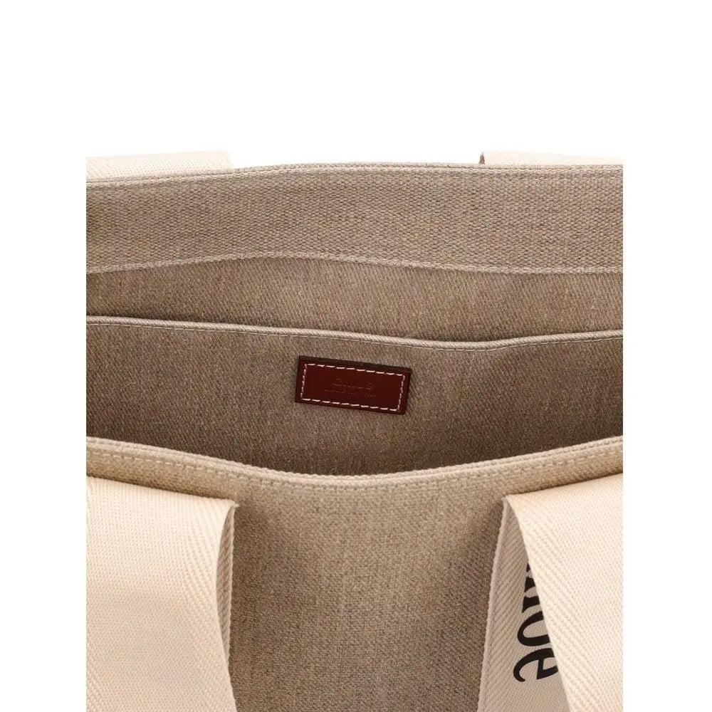 Beige linen tote bag med cremede håndtag og brun læderplet fra Chloé