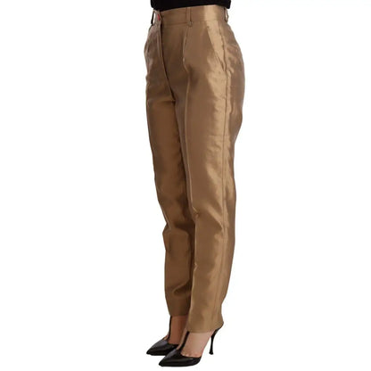Dolce & Gabbana Elegant Tapered Silk Trousers in Gold