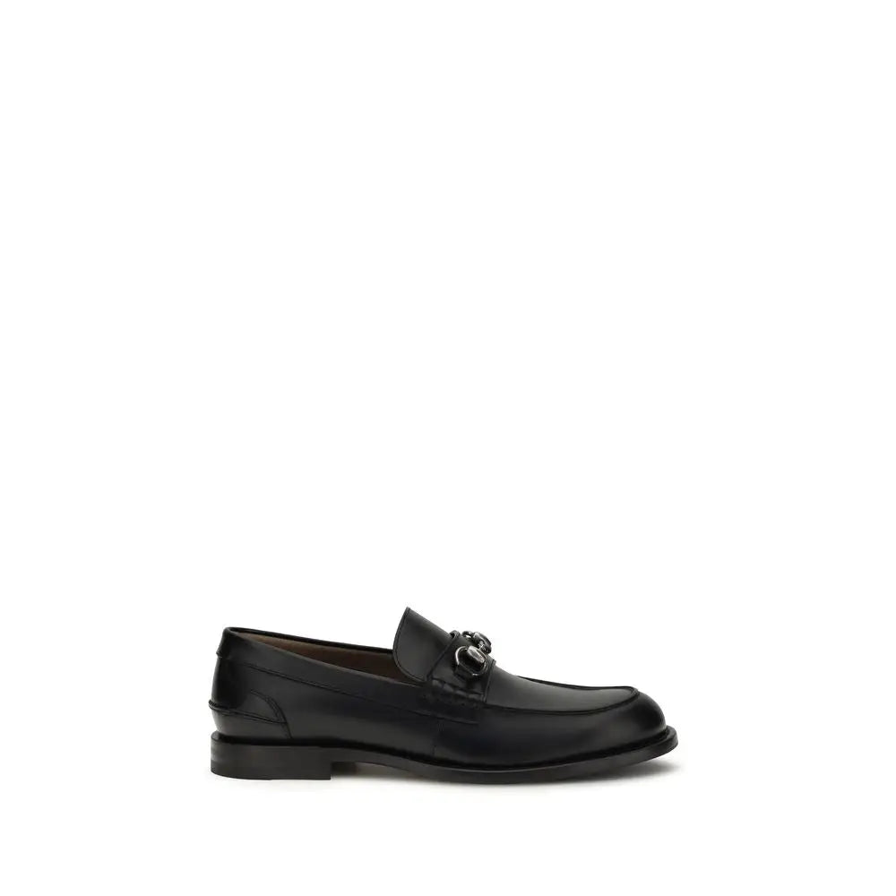 Gucci black calf slip-on loafers med poleret finish og sølvspænde