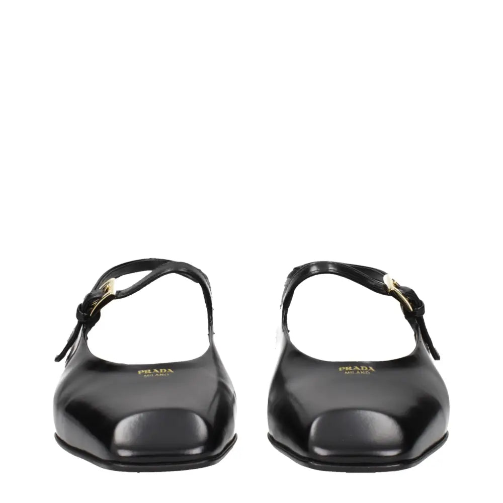 Prada black leather flat sandals with square-toe and gold buckle straps