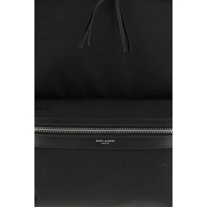 Saint Laurent black fabric backpack med minimalist design og sølv lynlås